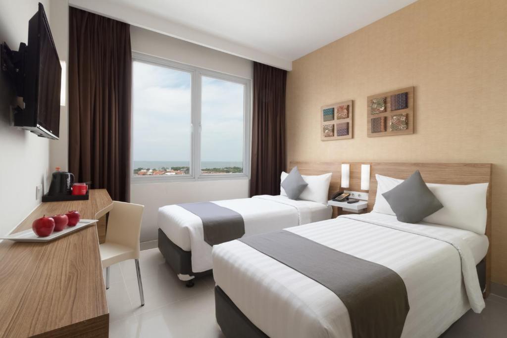 TV a/nebo společenská místnost v ubytování Hotel NEO Cirebon by ASTON