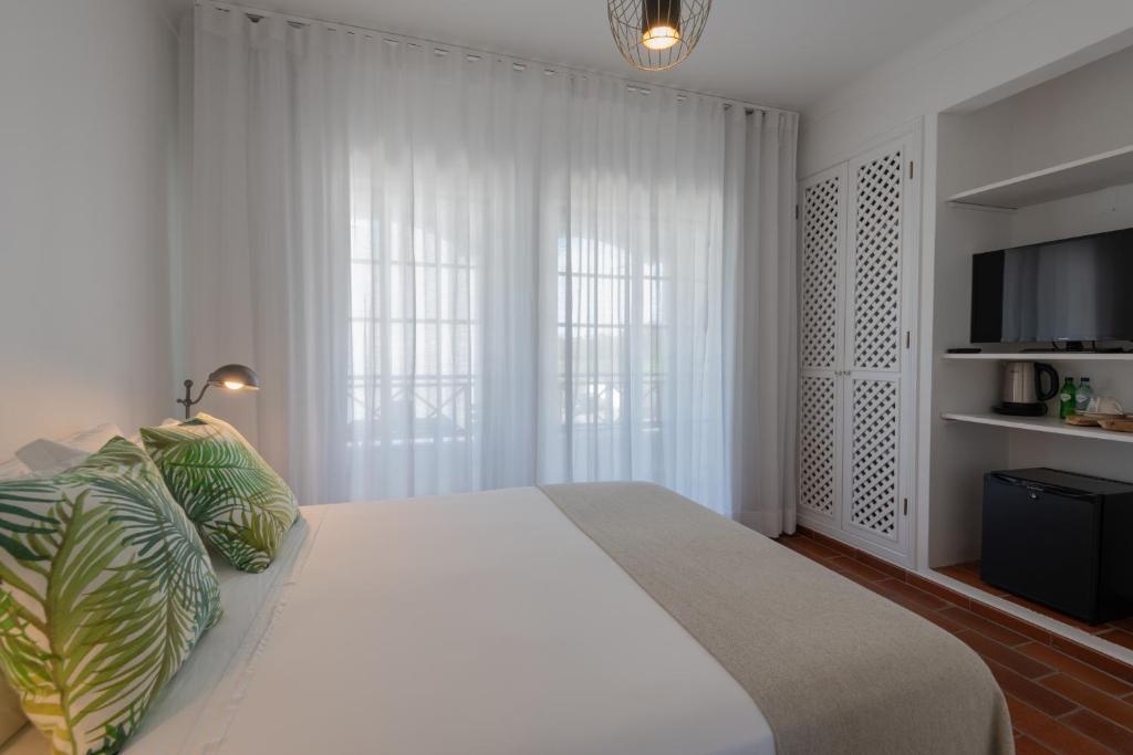 Postel nebo postele na pokoji v ubytování Villa Eira