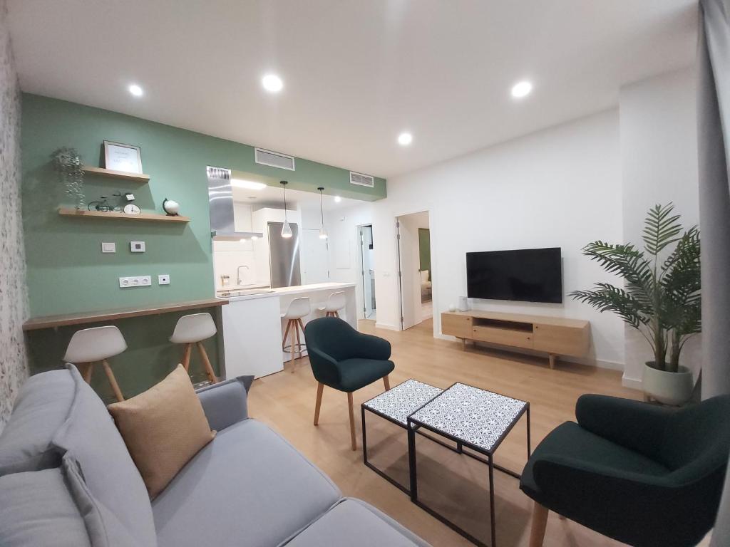 Televízia a/alebo spoločenská miestnosť v ubytovaní Del Parque Flats Teatro Plaza Premium