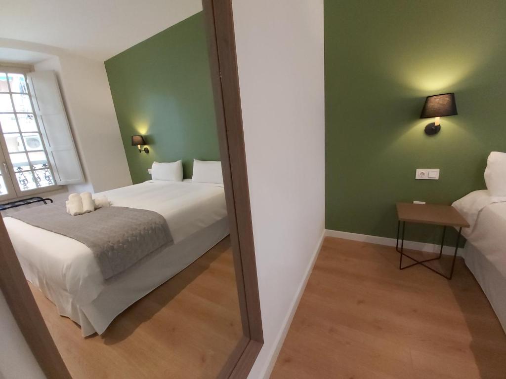 Posteľ alebo postele v izbe v ubytovaní Del Parque Flats Teatro Plaza Premium
