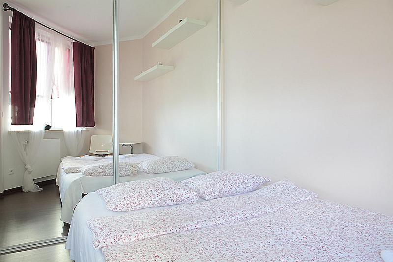 Posteľ alebo postele v izbe v ubytovaní Zygmunta Slominskiego 5 - P&O Apartments