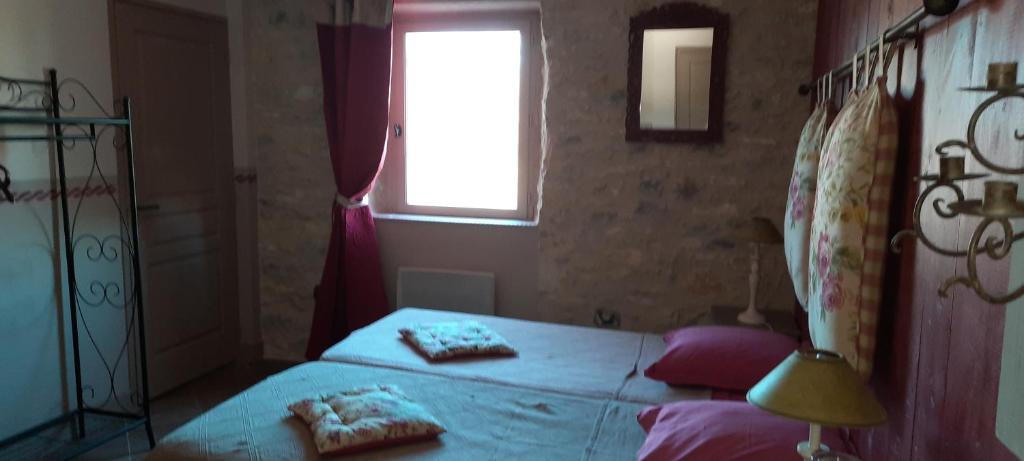 Postel nebo postele na pokoji v ubytování Chambre d'hôtes Au Picatal
