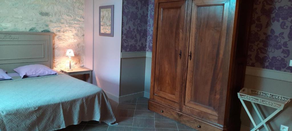 Postel nebo postele na pokoji v ubytování Chambre d'hôtes Au Picatal
