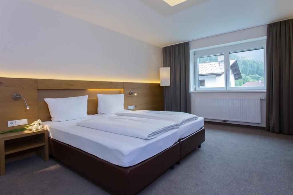 Postel nebo postele na pokoji v ubytování Hotel Rundeck