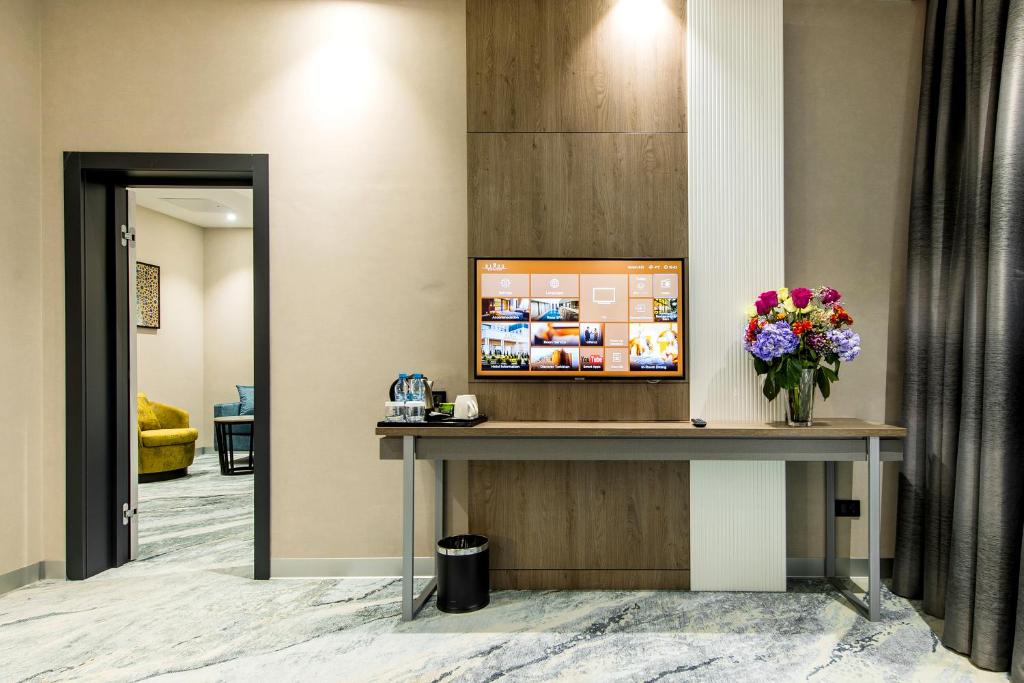 TV a/nebo společenská místnost v ubytování Rixos Turkistan