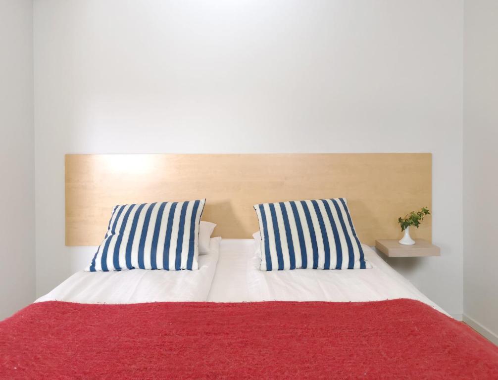 Postel nebo postele na pokoji v ubytování 2Home Hotel Apartments