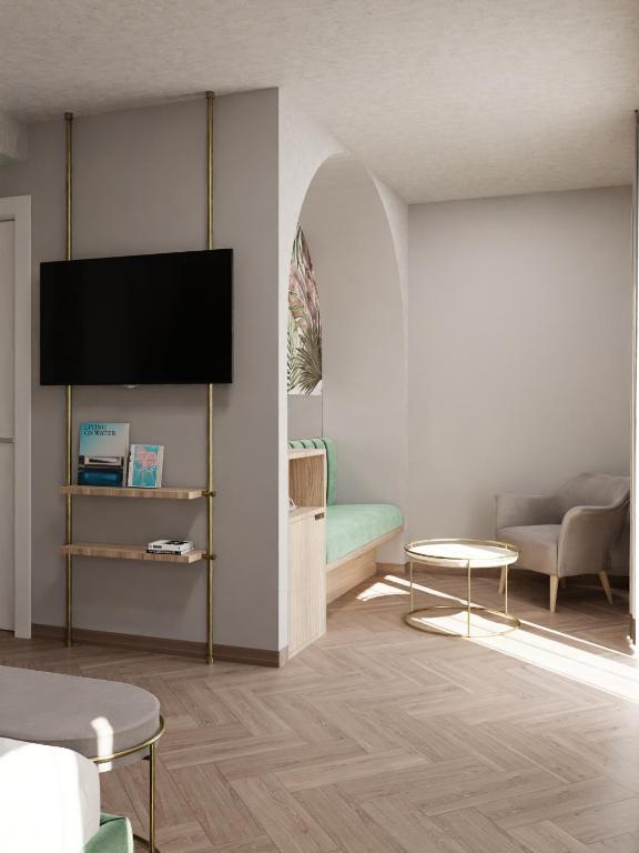 TV a/nebo společenská místnost v ubytování Salus Smart & Chic Hotel