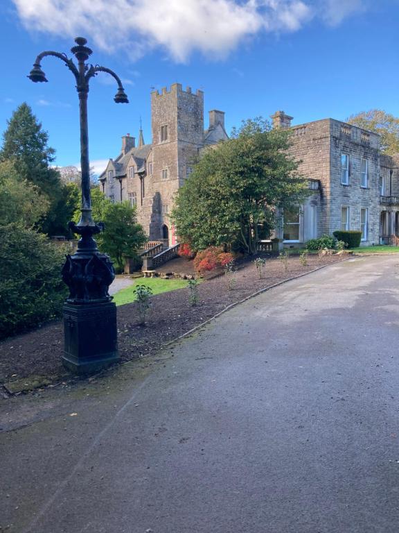 a street light in front of a large building at Tallentire Hall in Cockermouth