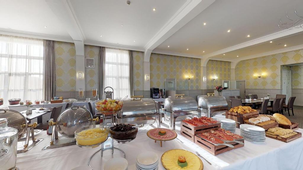 a buffet line with many different types of food at Ommaroo Hotel in Saint Helier Jersey