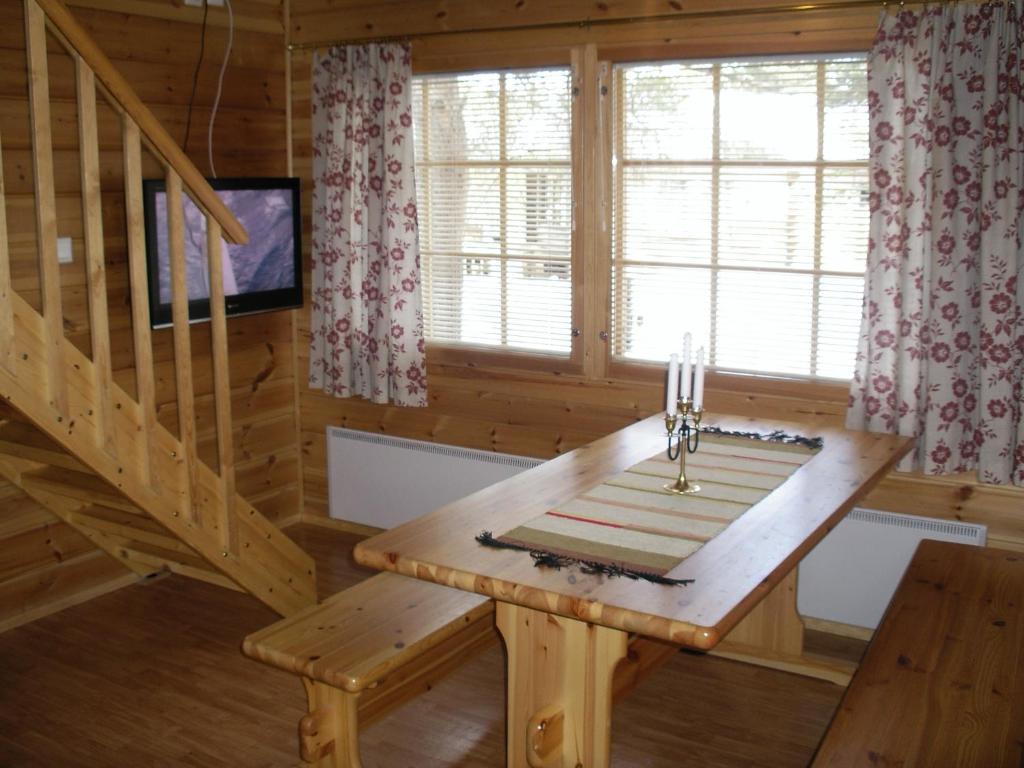 TV a/nebo společenská místnost v ubytování Ounasloma Holiday Cottages