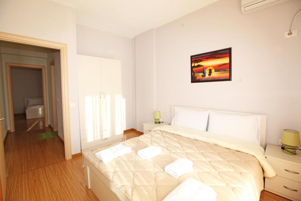 Postel nebo postele na pokoji v ubytování Teo Apartaments