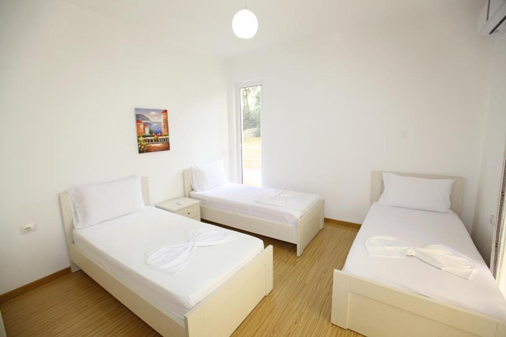 Postel nebo postele na pokoji v ubytování Teo Apartaments