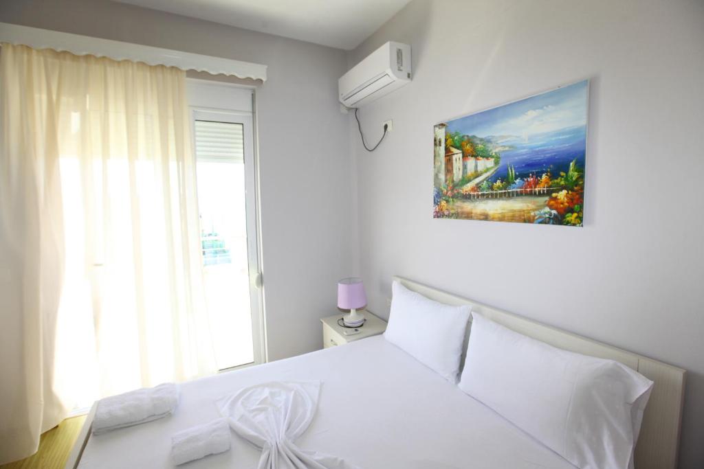 Postel nebo postele na pokoji v ubytování Teo Apartaments