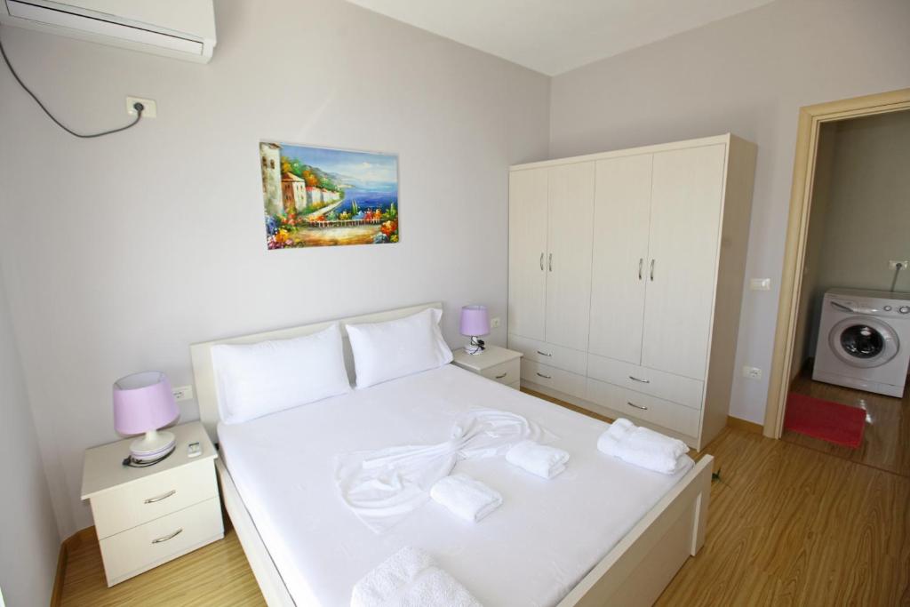 Postel nebo postele na pokoji v ubytování Teo Apartaments