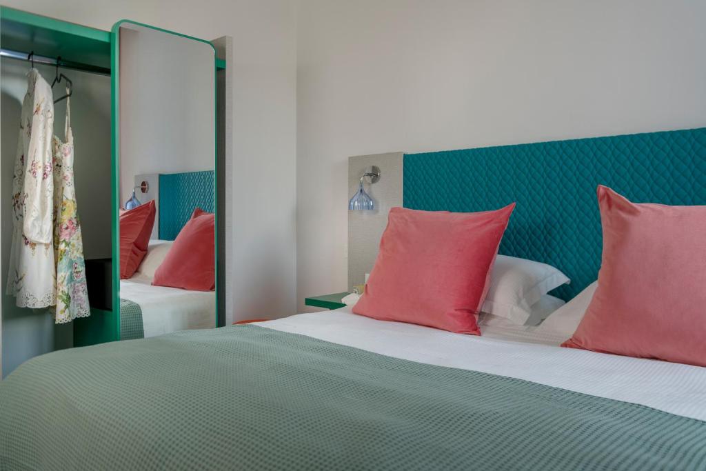 Postel nebo postele na pokoji v ubytování Hotel Rainbow ***S