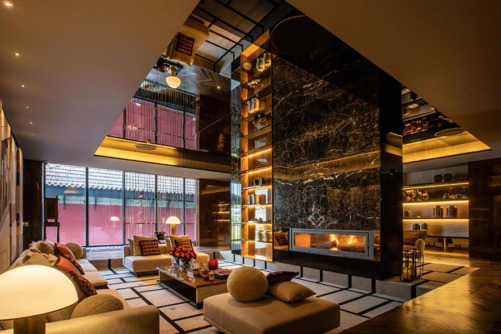 Een zitgedeelte bij Vinha Boutique Hotel - The Leading Hotels of the World