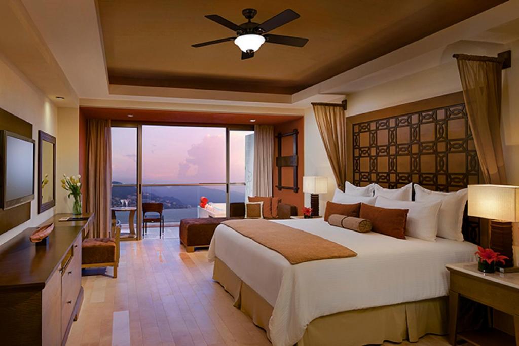 Postel nebo postele na pokoji v ubytování Dreams Vallarta Bay Resorts & Spa - All Inclusive