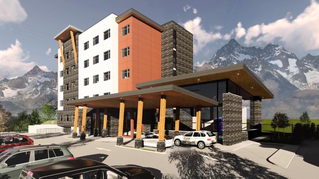 a rendering of a building with mountains in the background at Holiday Inn Express & Suites - Chilliwack East an IHG Hotel in Chilliwack