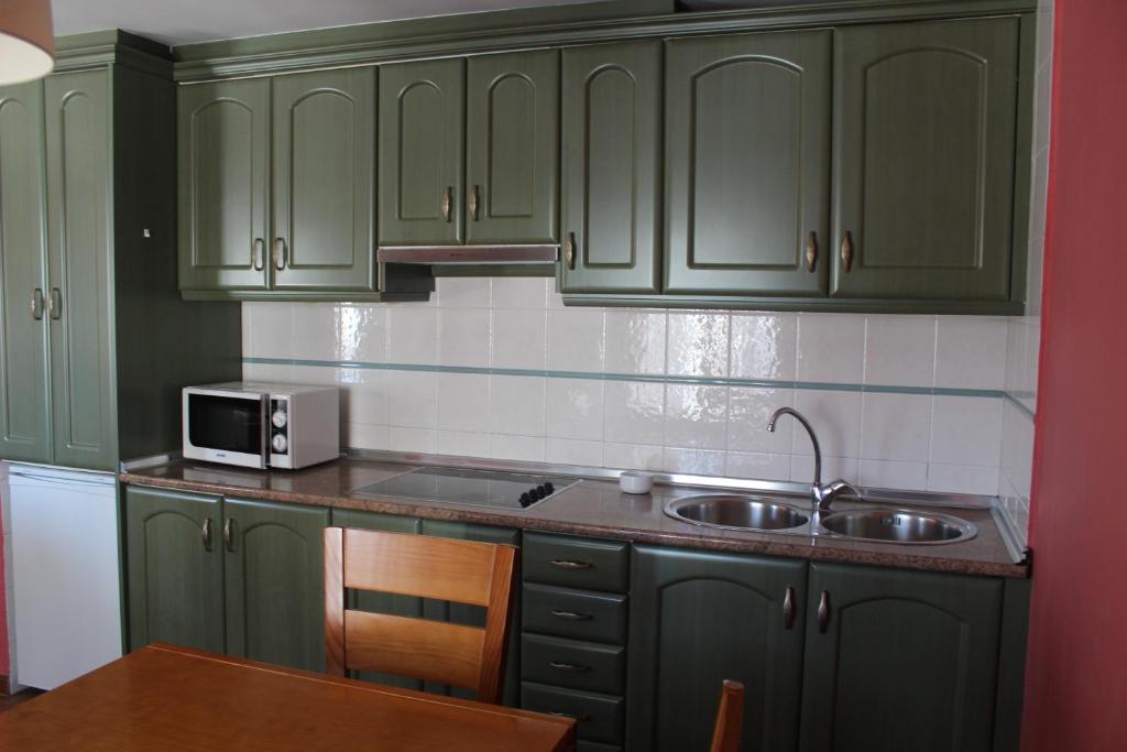 Kuchyň nebo kuchyňský kout v ubytování Apartamentos NOGUERA de ALBARRACÍN