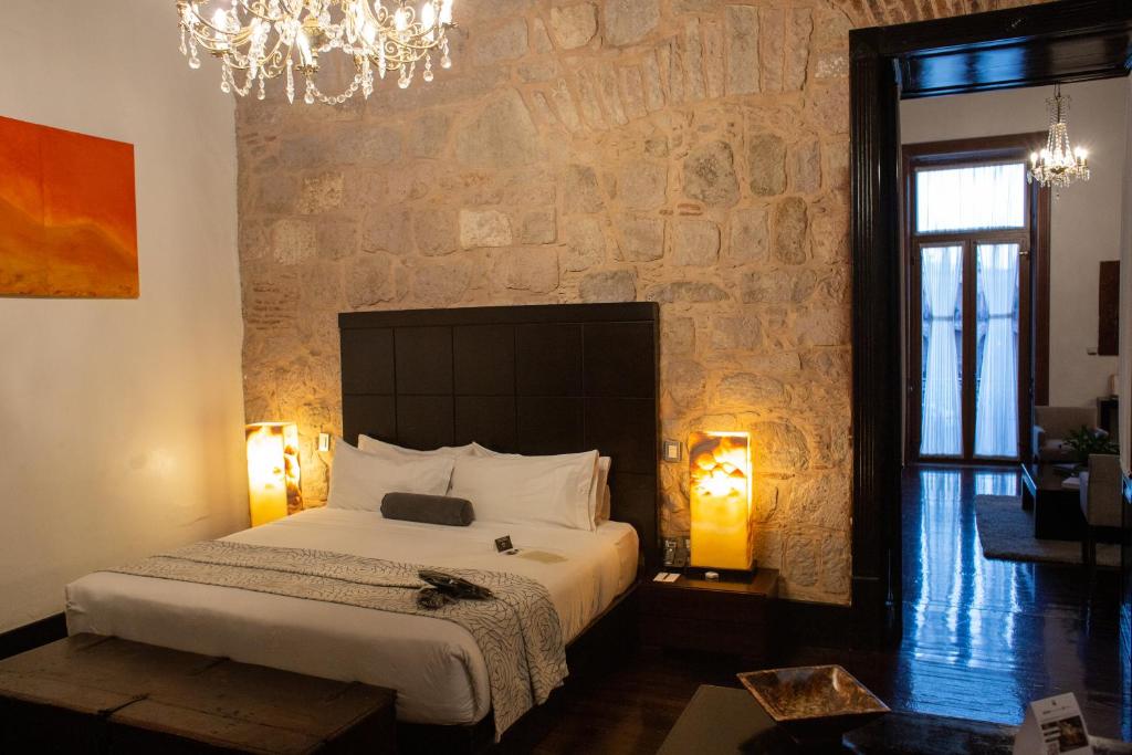 Postel nebo postele na pokoji v ubytování Cantera 10 Hotel Boutique