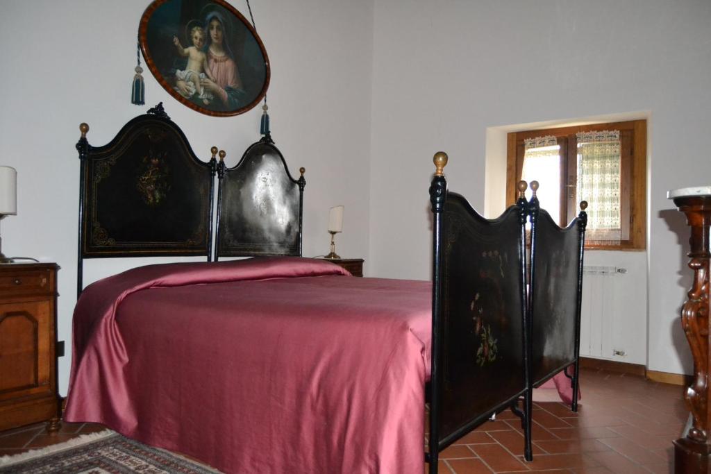Postel nebo postele na pokoji v ubytování Fattoria di Belvedere