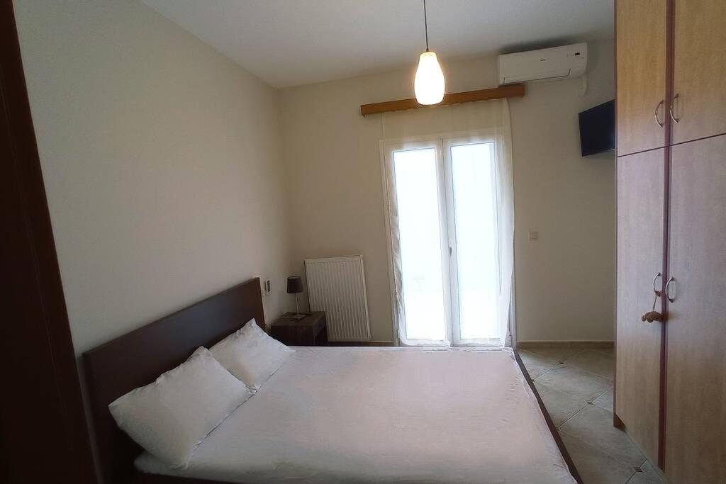 Posteľ alebo postele v izbe v ubytovaní Melina Apartment