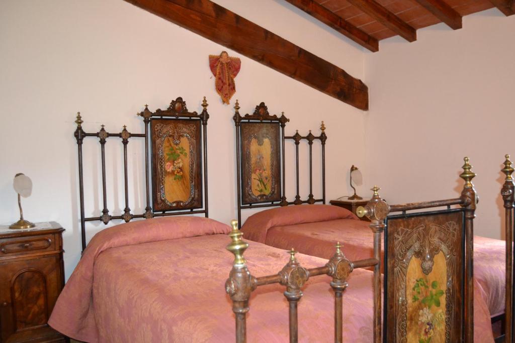Postel nebo postele na pokoji v ubytování Fattoria di Belvedere