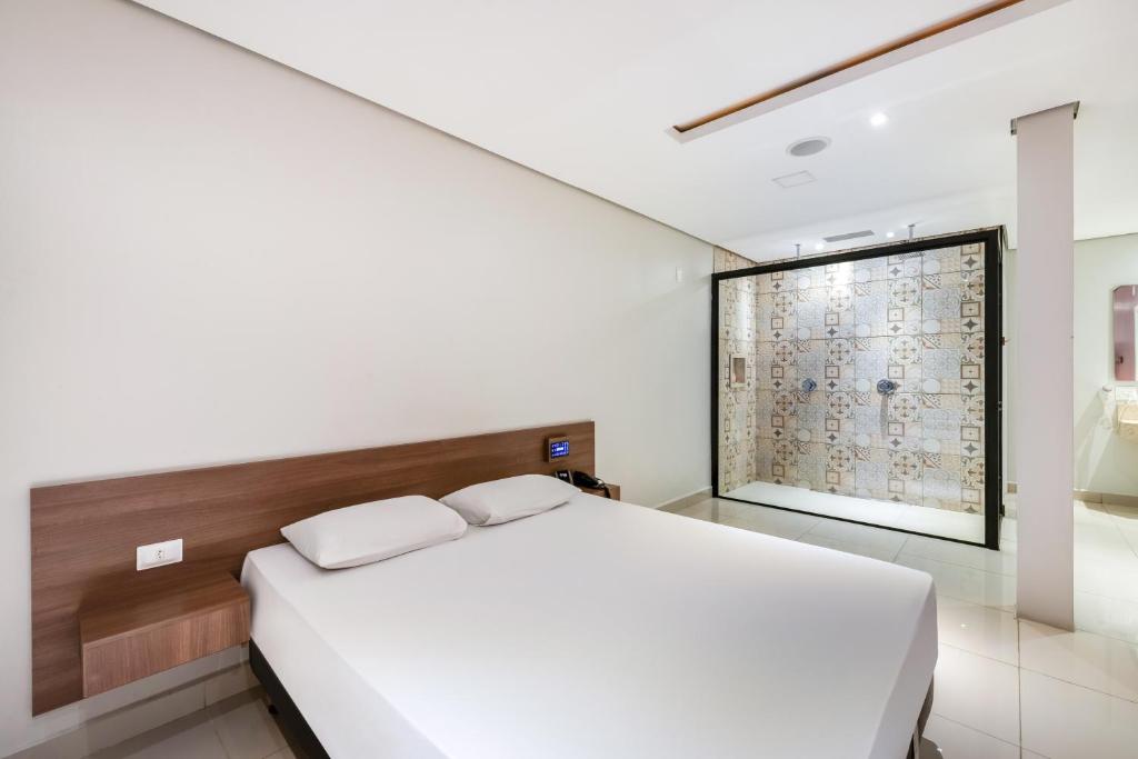 Postel nebo postele na pokoji v ubytování Plaza Motel