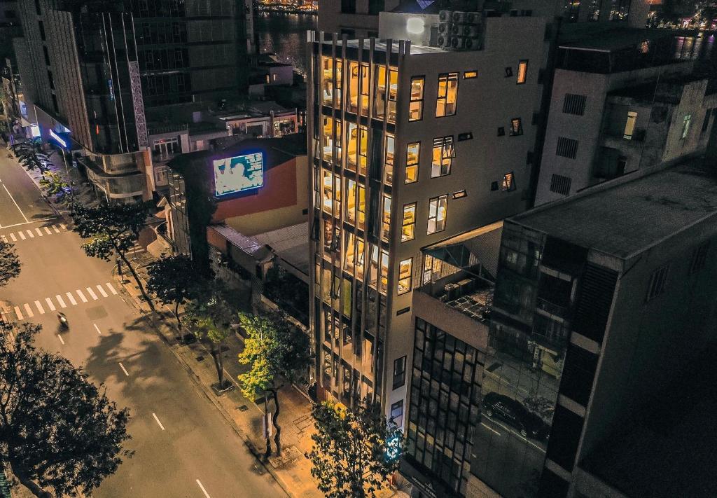 an overhead view of a building in a city at night at IKIGAI Dorm Hostel - Danang Centre in Da Nang