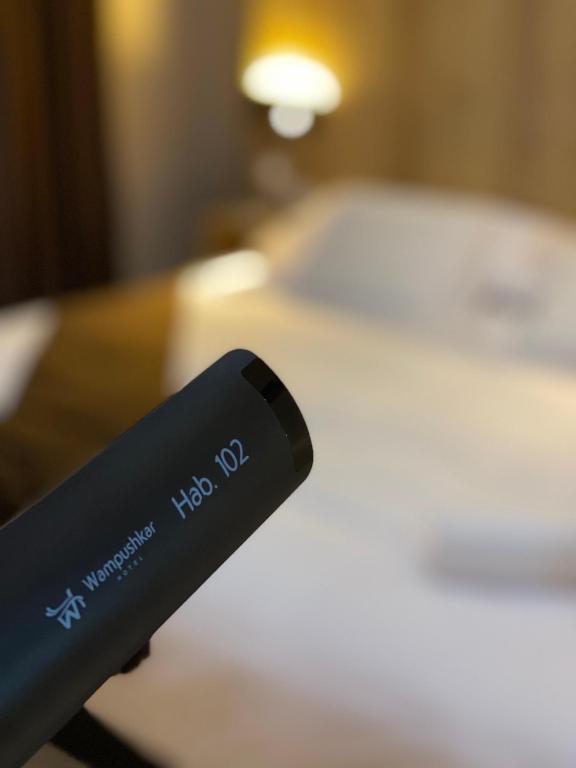 Postel nebo postele na pokoji v ubytování Hotel Wampushkar