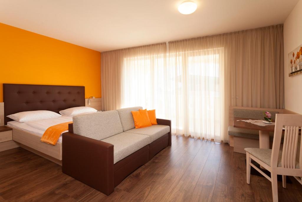 Postel nebo postele na pokoji v ubytování Hotel Mehrhauser