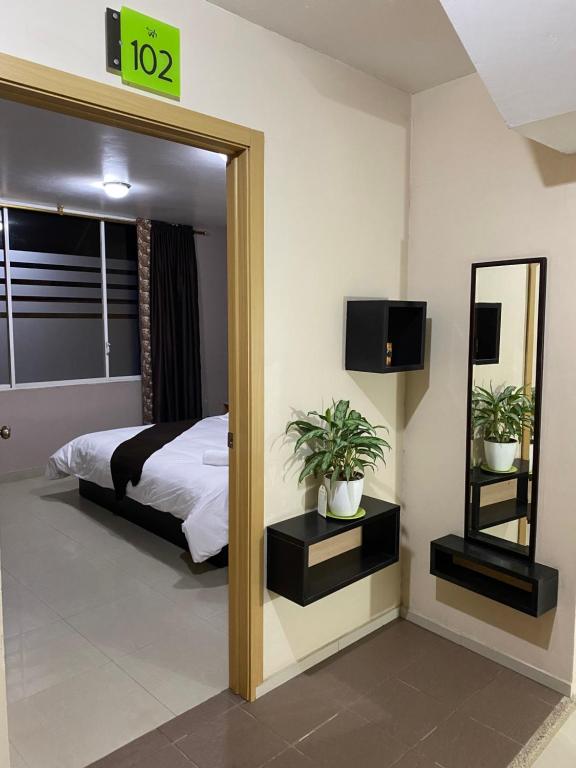 Postel nebo postele na pokoji v ubytování Hotel Wampushkar