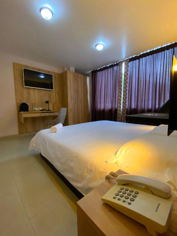 Postel nebo postele na pokoji v ubytování Hotel Wampushkar