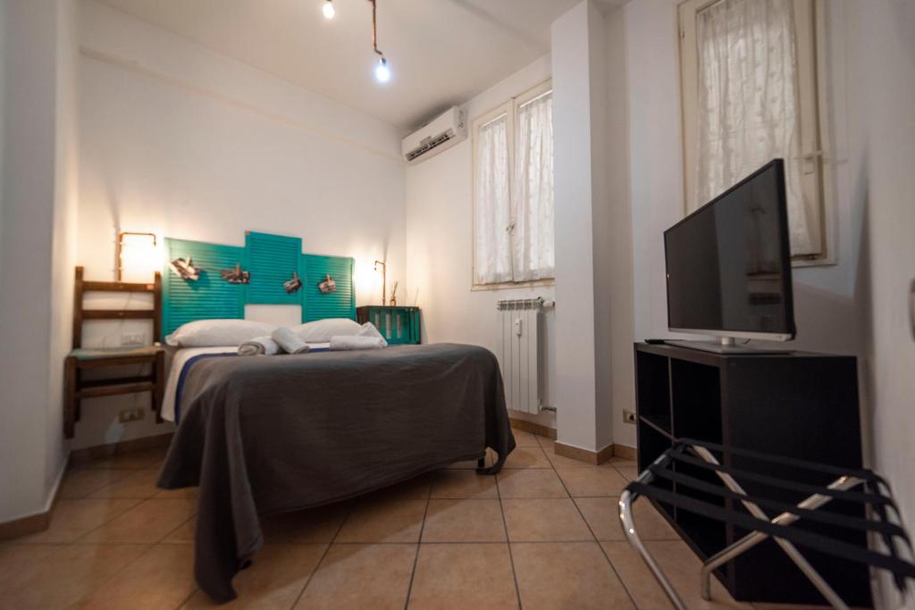 Posteľ alebo postele v izbe v ubytovaní Appartamento Monsone