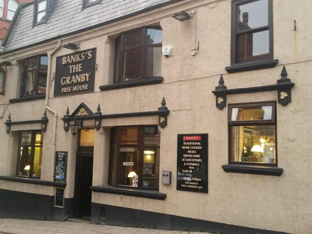 a building with a sign on the front of it at The Granby hotel in Whitby