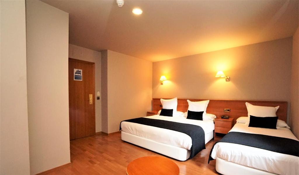 Postel nebo postele na pokoji v ubytování Hotel & SPA Niunit