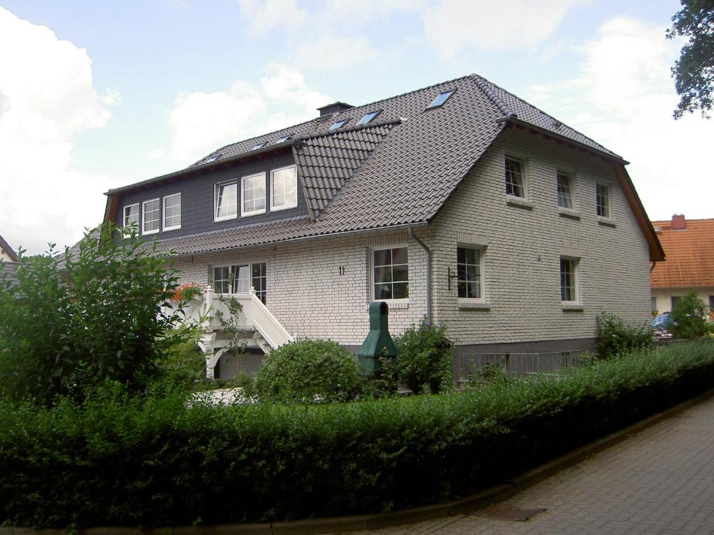 a large white house with a gambrel roof at Ferienwohnung Gauger-Binz auf Rügen in Binz