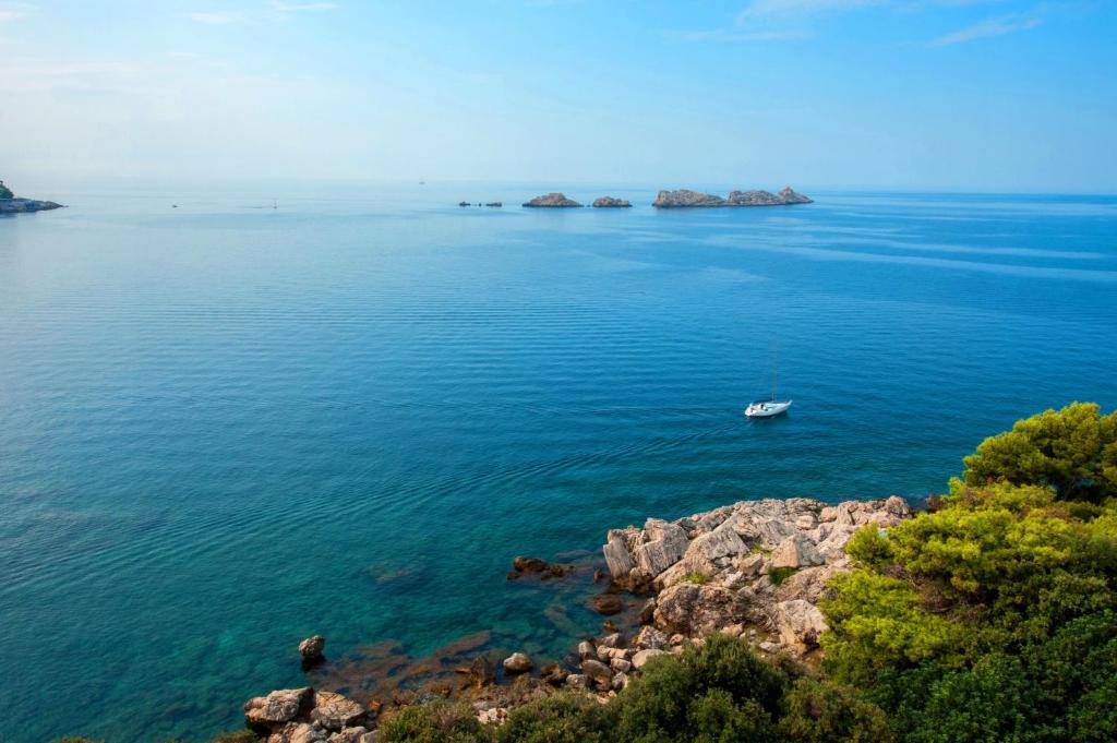 a boat in the middle of a large body of water at Royal Neptun Hotel in Dubrovnik