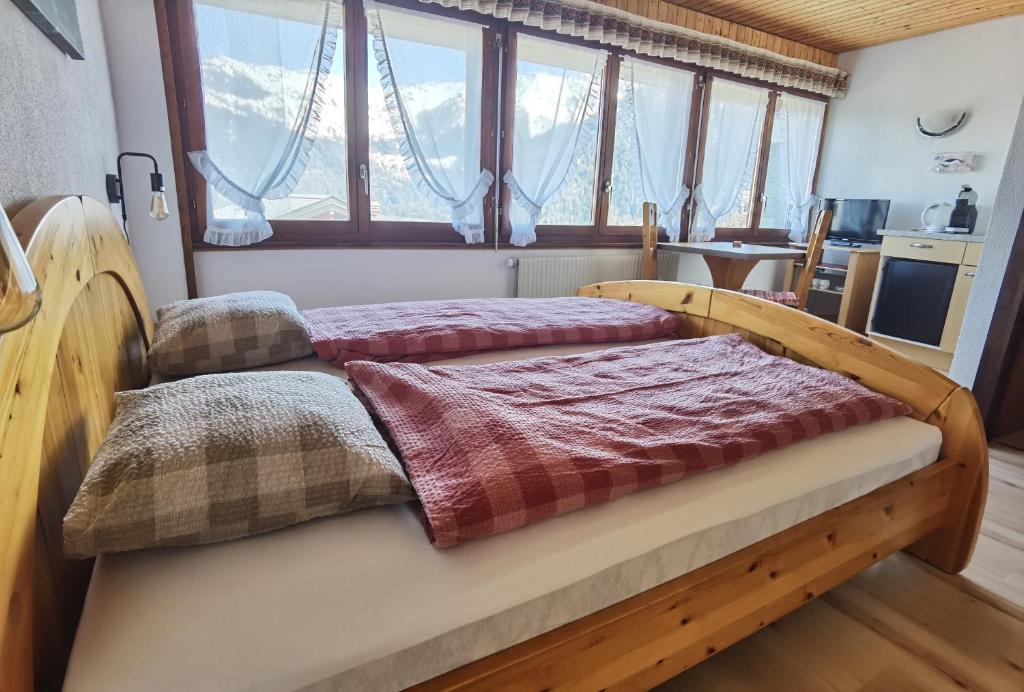 Postel nebo postele na pokoji v ubytování Auberge la Tzoumaz