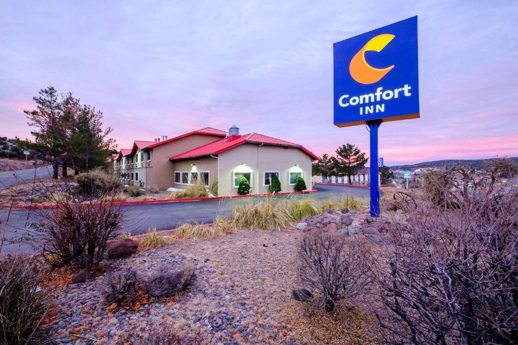a sign for a comfort inn in front of a building at Comfort Inn Near Gila National Forest in Silver City