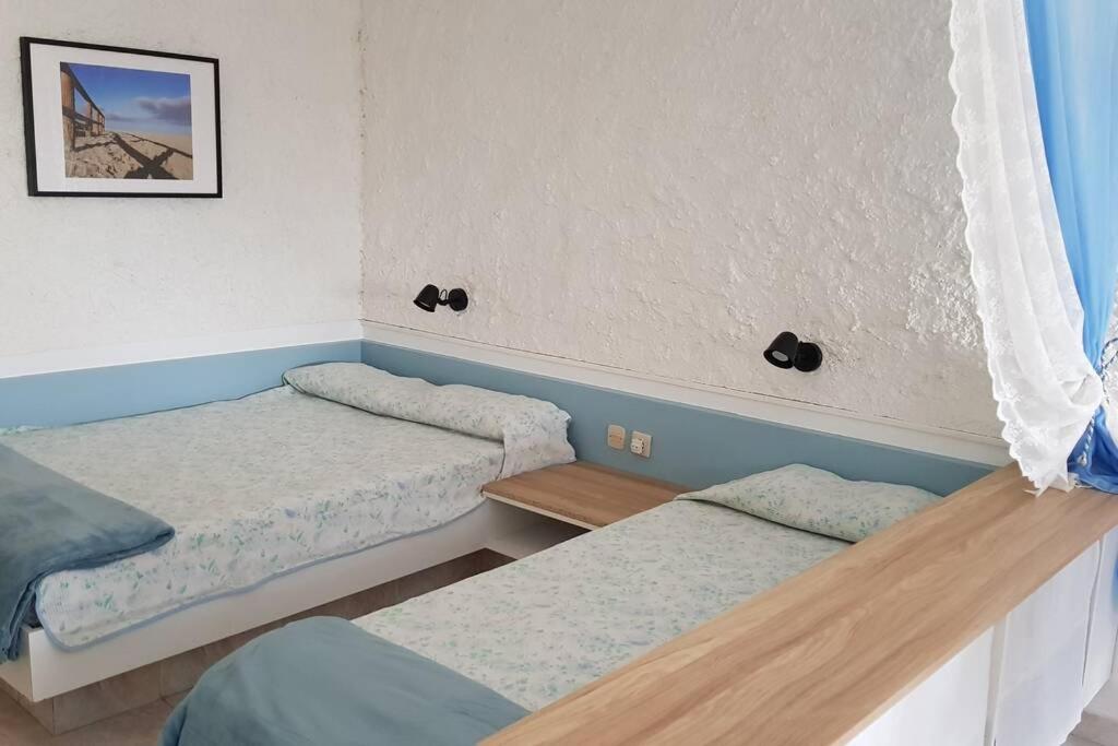 Postel nebo postele na pokoji v ubytování Front Beach Jandía Apartment