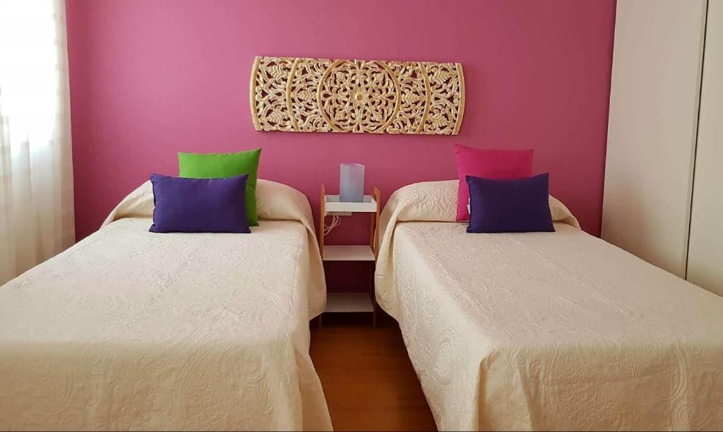 Posteľ alebo postele v izbe v ubytovaní APARTAMENTO CORTADURA BEACH