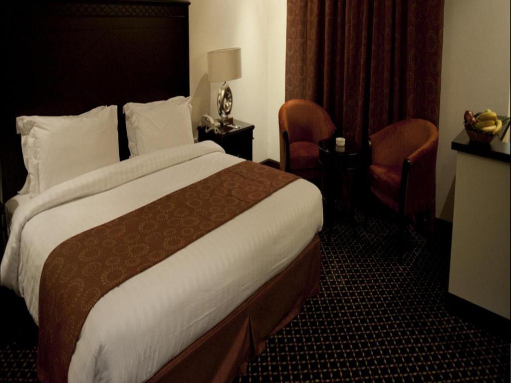 Postel nebo postele na pokoji v ubytování Musherib Hotel