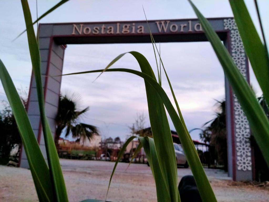 a sign at the entrance to the museum of naoshima world at Nostalgia World OTEL in Kızılot