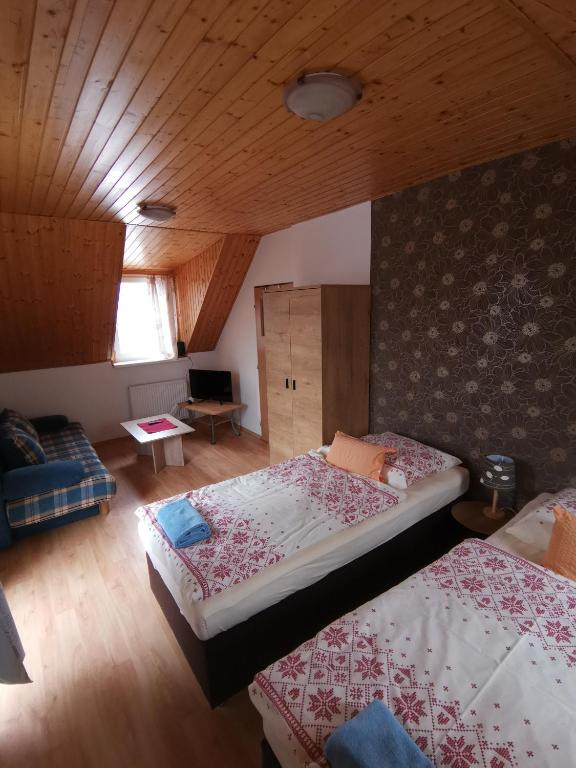 Postel nebo postele na pokoji v ubytování A1 Štart
