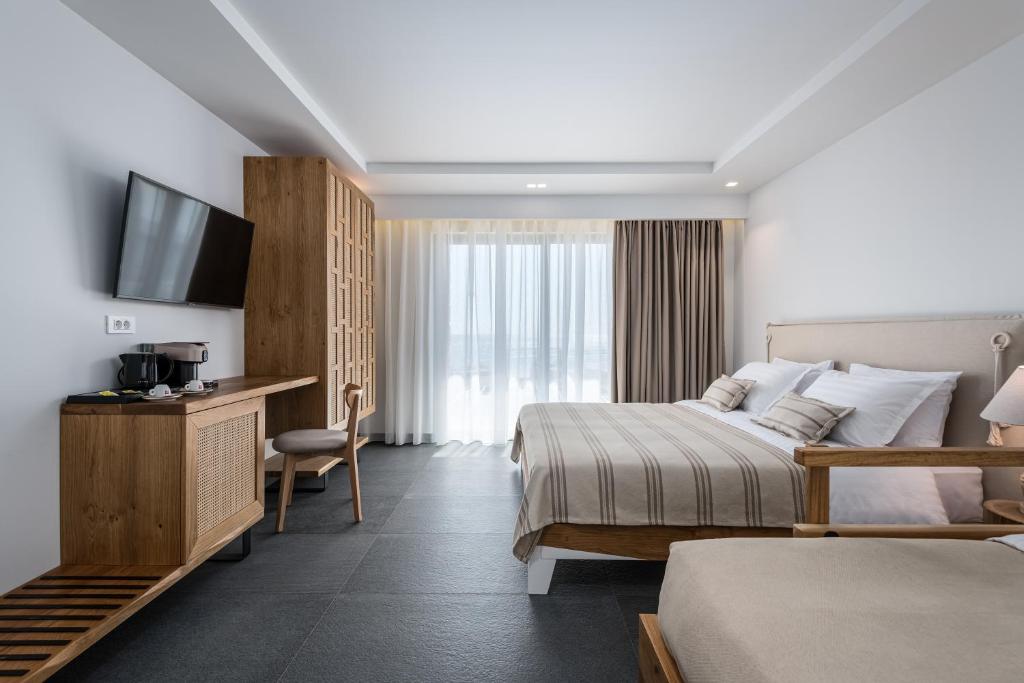 Postel nebo postele na pokoji v ubytování NISSEA Boutique Hotel