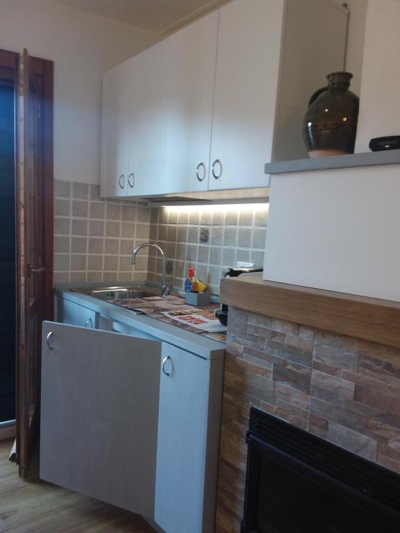 Kuchyň nebo kuchyňský kout v ubytování Rina Rooms
