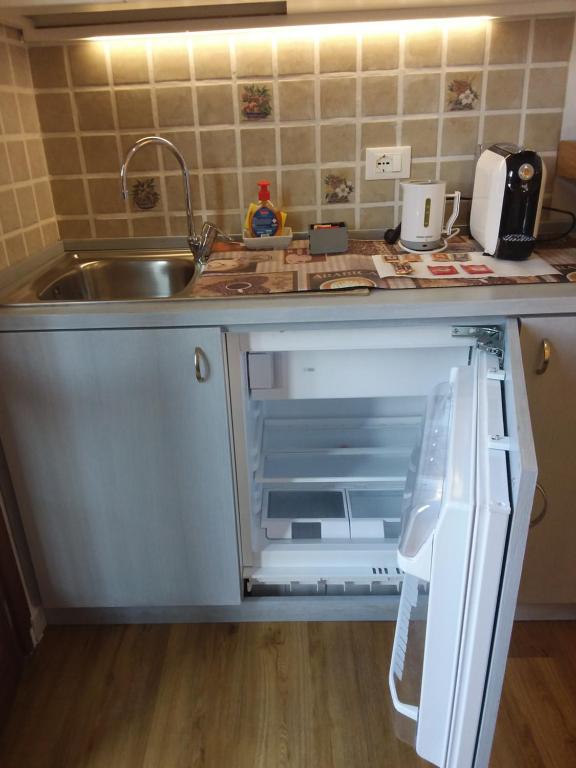 Kuchyň nebo kuchyňský kout v ubytování Rina Rooms