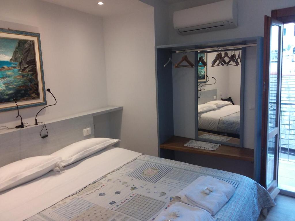 Postel nebo postele na pokoji v ubytování Rina Rooms