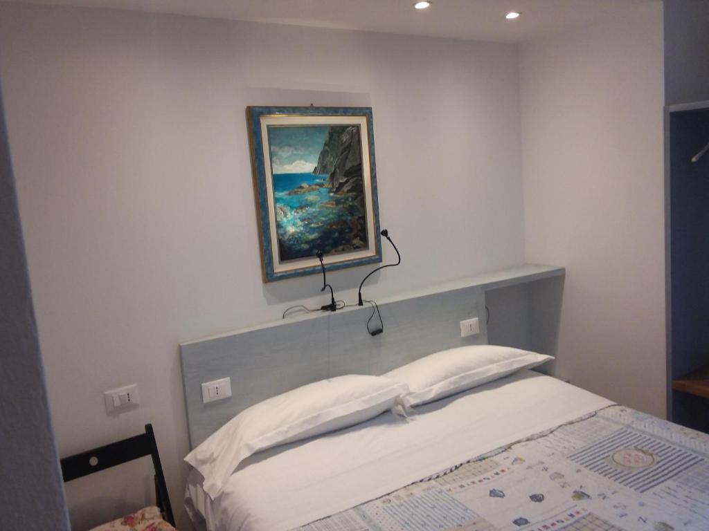 Postel nebo postele na pokoji v ubytování Rina Rooms